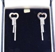 A pair of 18ct art deco style white gold earrings