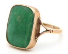 An antique 9ct rose gold ring set with jade, size