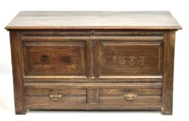 An 18thC. oak mule chest, carved 