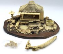 An early 20thC. Japanese bone garden on rosewood p