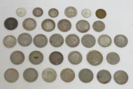 A quantity of mostly white metal & silver coinage including British Victorian & an Imitation of Sove