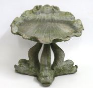 A lead garden water feature with three dolphins ho