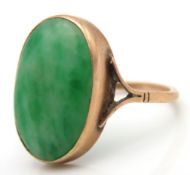 An antique 9ct rose gold ring set with jade, size