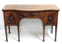 An 18thC. George III tulipwood serpentine front si