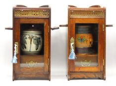 Two oak pipe smokers cabinets with tobacco jars, g
