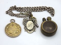 A silver Albert chain with silver fob twinned with a silver medallion & a trench art lighter, silver