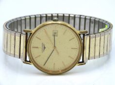 A gents Longines wristwatch with inscription on reverse 'MRH from FT Ltd for 20years service'