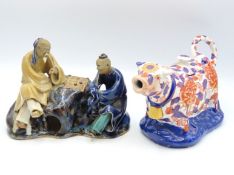 A Chinese cow creamer twinned with a Chinese stone