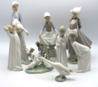 Six Lladro porcelain figurines, one Nao figure wit