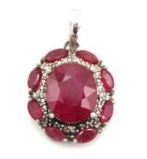 A silver pendant set with ruby & diamond, main sto