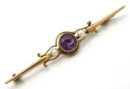 A yellow metal bar brooch set with amethyst & pear