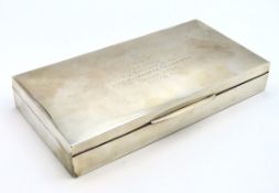 A large white metal cigar case inscribed 