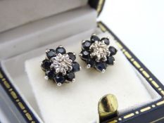 A pair of 9ct gold diamond & sapphire earrings, 10.5mm diameter. 2.5g