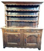 An 18thC. continental oak dresser, 1890mm high x 1