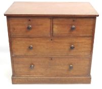 An antique four drawer mahogany chest of drawers,