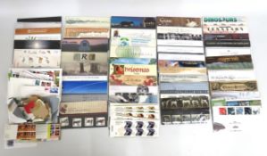 A quantity of 48 presentation packs of mint stamps