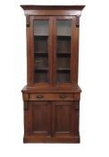 A Victorian mahogany bookcase with cupboard & draw