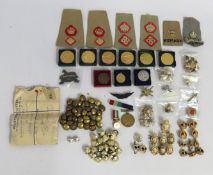 A collection of military related badges including