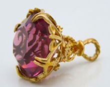 A 9ct gold mounted fob with amethyst stone, 26mm t