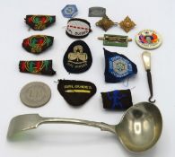 A selection of girl guide badges twinned with a '