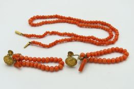 A c.1920's coral necklace set with 9ct gold clasp,