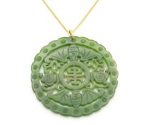 A Chinese carved jade pendant with bat decor, 50mm