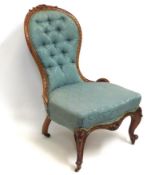 A 19thC. English walnut spoon back nursing chair w