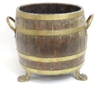 A 19thC. coopered oak barrel repurposed as log buc