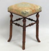 A Victorian walnut piano stool by Henry Brooks, 52