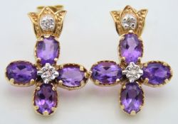 A pair of 14ct gold earrings set with amethyst & d