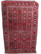 A wool Persian style rug, approx. 2100mm x 1300mm