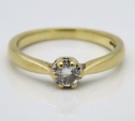 A 15ct gold diamond solitaire ring set with estima