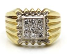 A gents yellow metal ring set with nine diamonds o