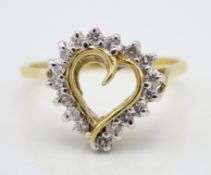 A 18ct gold ring with heart shape head set with ap