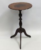 A Georgian mahogany wine table with scalloped edge