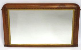 A 19thC. over mantle wall mirror with satinwood ve