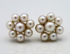 A pair of 9ct gold mounted pearl floral cluster ea