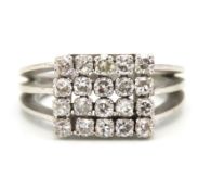 A white metal ring set with twenty diamonds of app