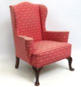 A small Victorian wingback upholstered armchair, s