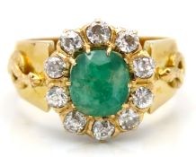 A large yellow metal ring, set with approx. 1ct di