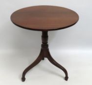 A George III mahogany tilt top table, damage to on