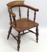 A 19thC. elm smoker's bow chair, joints a little l