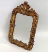 A decorative gilt framed dressing table mirror, 36