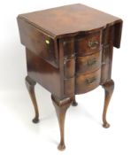 A reproduction serpentine fronted three drawer wor