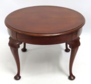 A low level circular mahogany coffee table, 590mm
