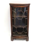 A bow fronted mahogany Georgian style glazed displ