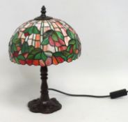A Tiffany style table lamp, some damage to shade,