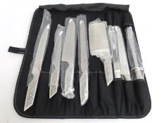 An Anthony Worrell Thompson chef set roll of knive