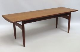 A mid century Danish teak coffee table, two scratc