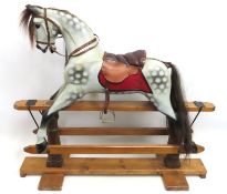 An F. H. Ayres style child's dappled grey vintage rocking horse, 1115mm tall x 1265mm wide